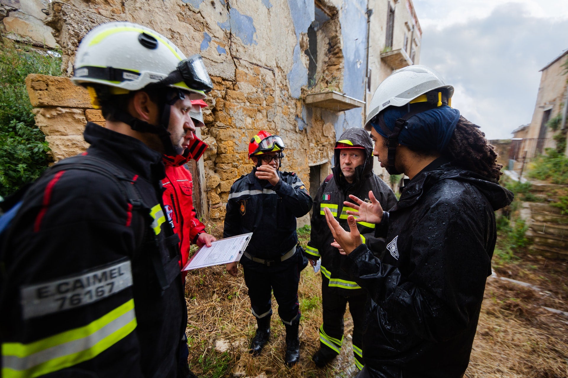 A group of first responders in training discussing together